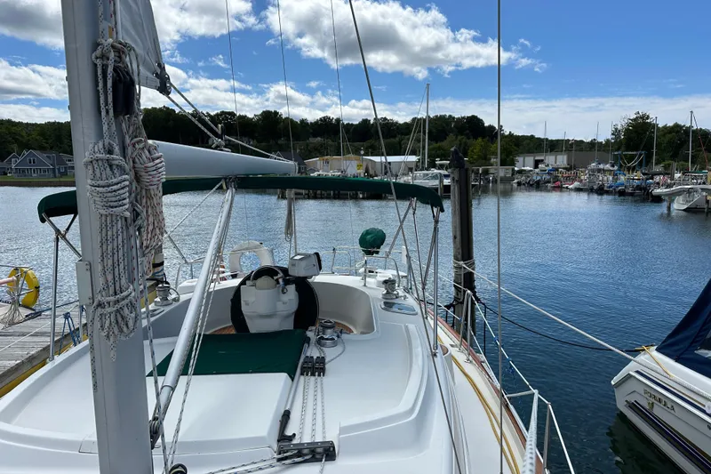 Slide: The Image of Beneteau Oceanis 36 CC sailboat docked in a marina, 2000 model, clear sky. - 16