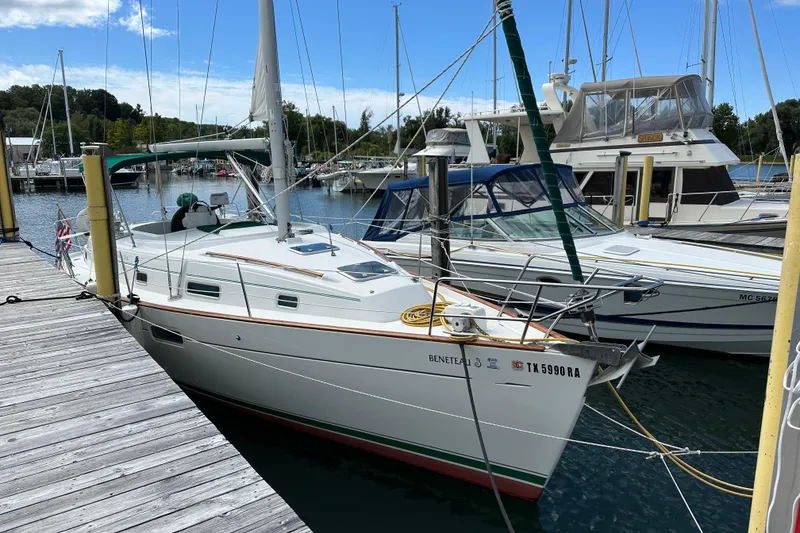 Slide: The Image of Beneteau Oceanis 36 CC sailboat docked at marina, 2000 model, sunny day. - 2