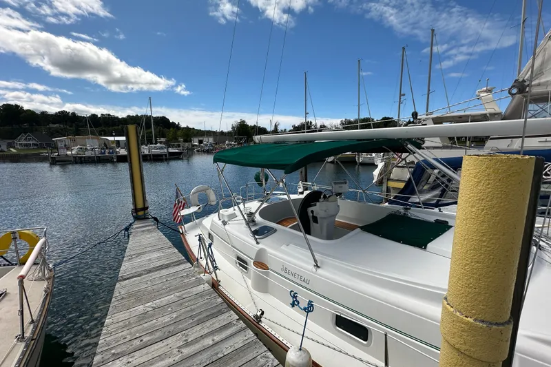 Slide: The Image of Beneteau Oceanis 36 CC sailboat docked at marina, 2000 model, under clear blue sky. - 4