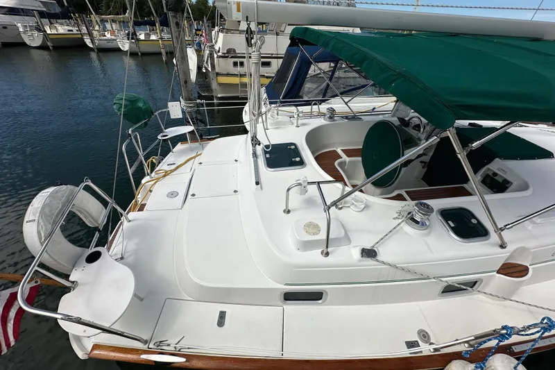 Slide: The Image of Beneteau Oceanis 36 CC sailboat, 2000 model, docked with green canopy and clean deck. - 5