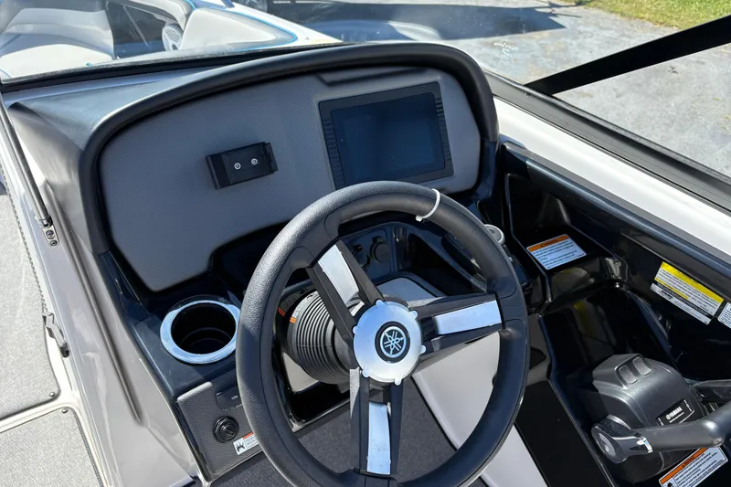 Slide: The Image of 2020 Yamaha Boats AR240 dashboard with steering wheel and control panel. - 10