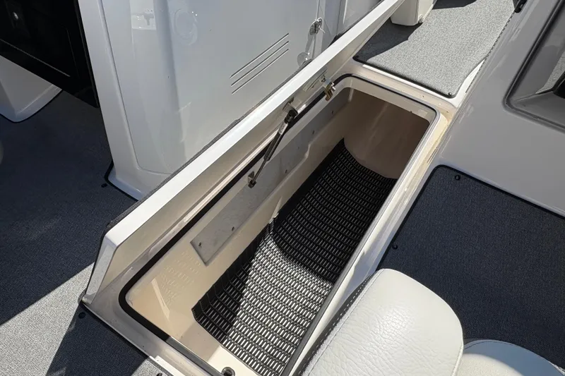 Slide: The Image of Open storage compartment on 2020 Yamaha Boats AR240, featuring spacious interior and durable design. - 24