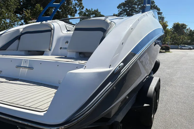Slide: The Image of 2020 Yamaha Boats AR240 on trailer, showcasing sleek design and spacious seating. - 5
