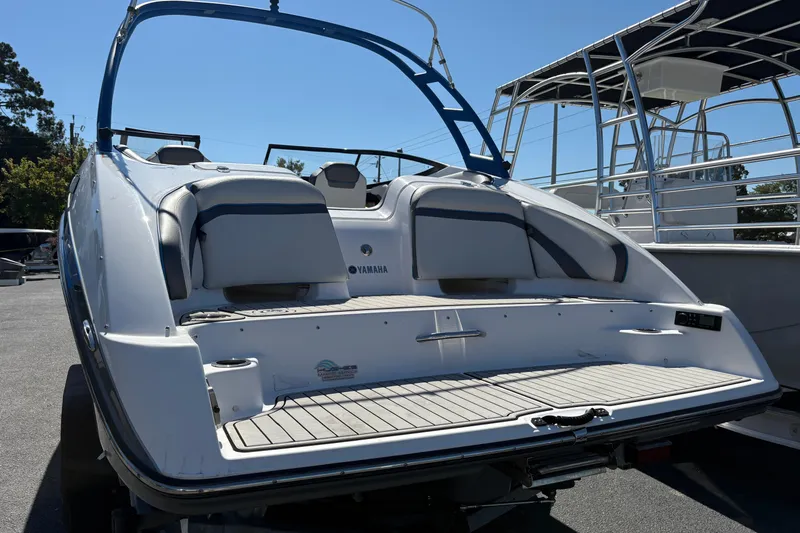 Slide: The Image of 2020 Yamaha Boats AR240, rear view, showcasing sleek design and spacious seating. - 8