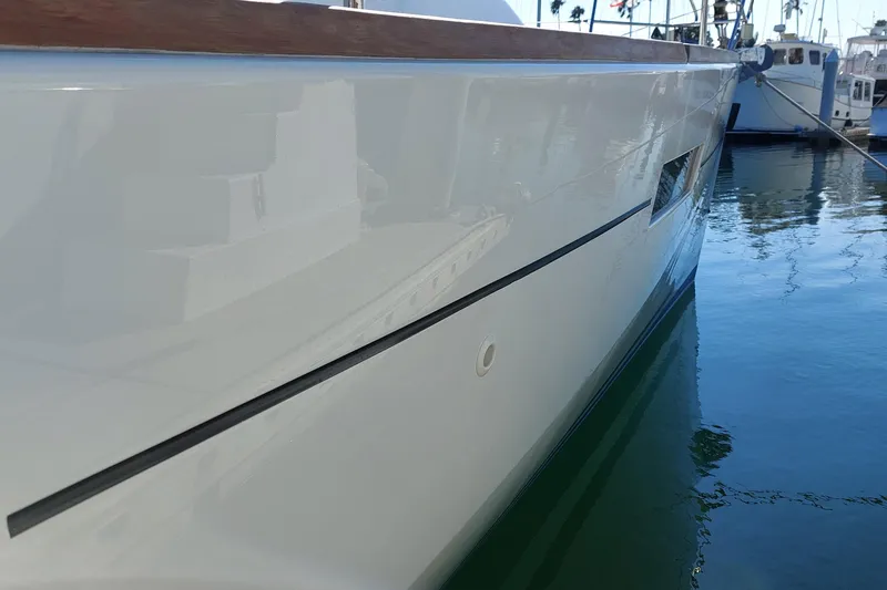 Slide: The Image of 2015 Beneteau Oceanis 45 yacht side view, docked in a marina. - 13