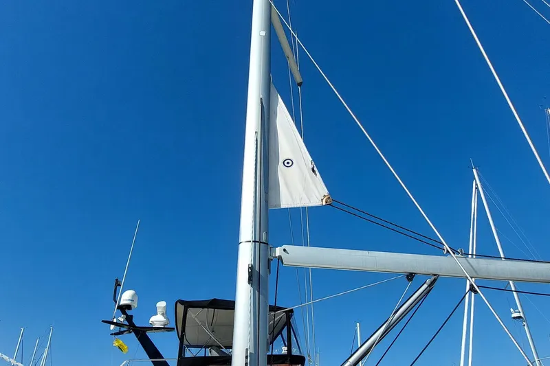 Slide: The Image of Sailboat mast and rigging of 2015 Beneteau Oceanis 45 against clear blue sky. - 15