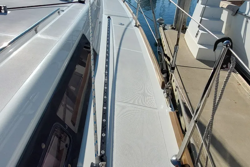 Slide: The Image of Deck view of a 2015 Beneteau Oceanis 45 yacht docked at a marina. - 20