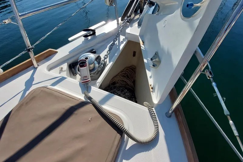 Slide: The Image of Beneteau Oceanis 45 (2015) yacht deck with anchor locker and winch. - 22