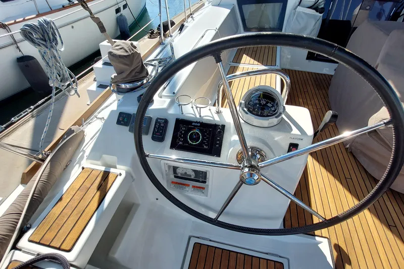Slide: The Image of Steering wheel and navigation instruments on 2015 Beneteau Oceanis 45 yacht deck. - 31