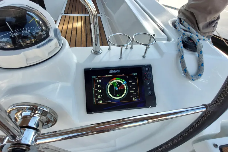 Slide: The Image of Beneteau Oceanis 45 yacht cockpit with navigation instruments, compass, and rope, 2015 model. - 33