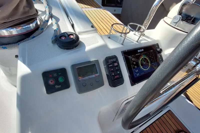 Slide: The Image of Cockpit of 2015 Beneteau Oceanis 45 with navigation instruments and steering wheel. - 35