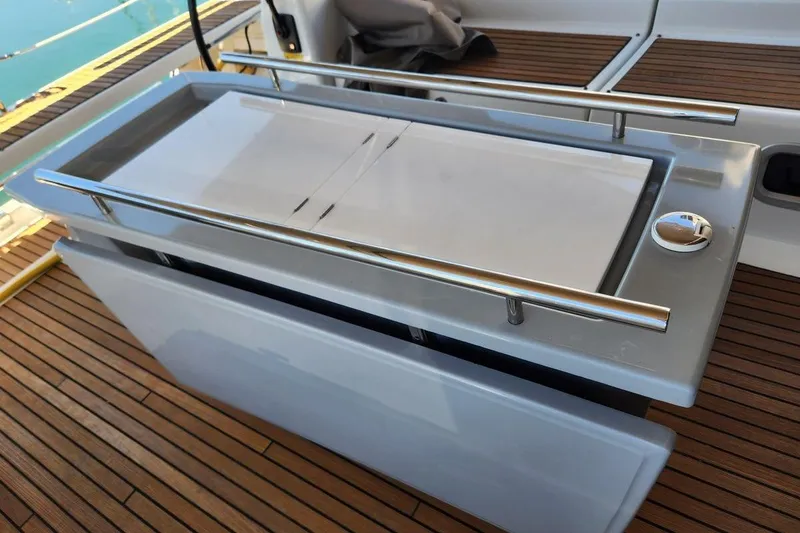 Slide: The Image of Beneteau Oceanis 45 (2015) yacht deck with sleek outdoor kitchen setup. - 38