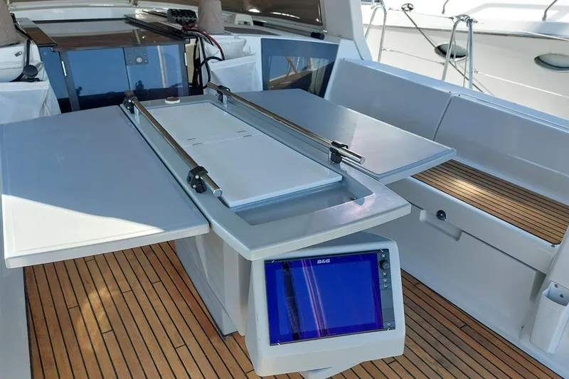 Slide: The Image of Beneteau Oceanis 45 cockpit with navigation equipment and foldable table, 2015 model. - 42