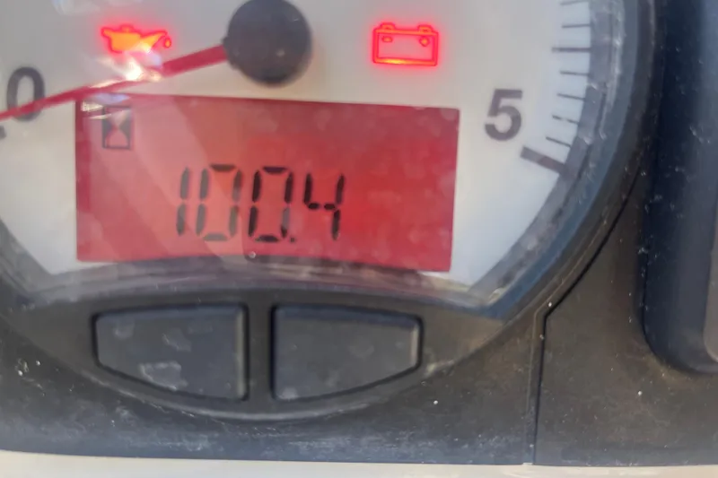 Slide: The Image of Close-up of Beneteau Oceanis 45 gauge showing 100.4 hours with warning lights. - 46