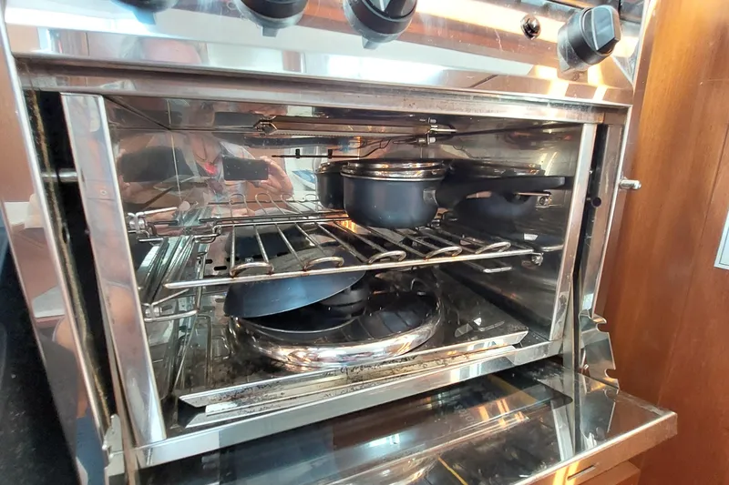 Slide: The Image of Oven with cookware inside on a 2015 Beneteau Oceanis 45 yacht. - 55