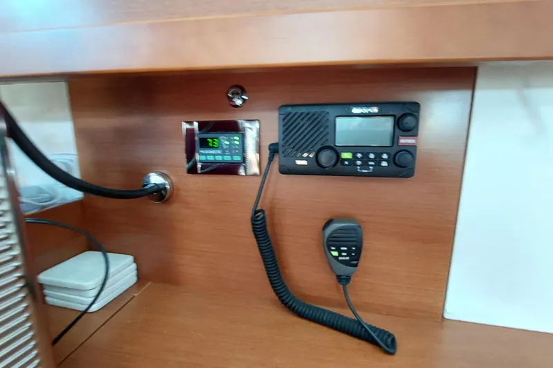 Slide: The Image of Control panel and radio equipment on a 2015 Beneteau Oceanis 45 yacht. - 60