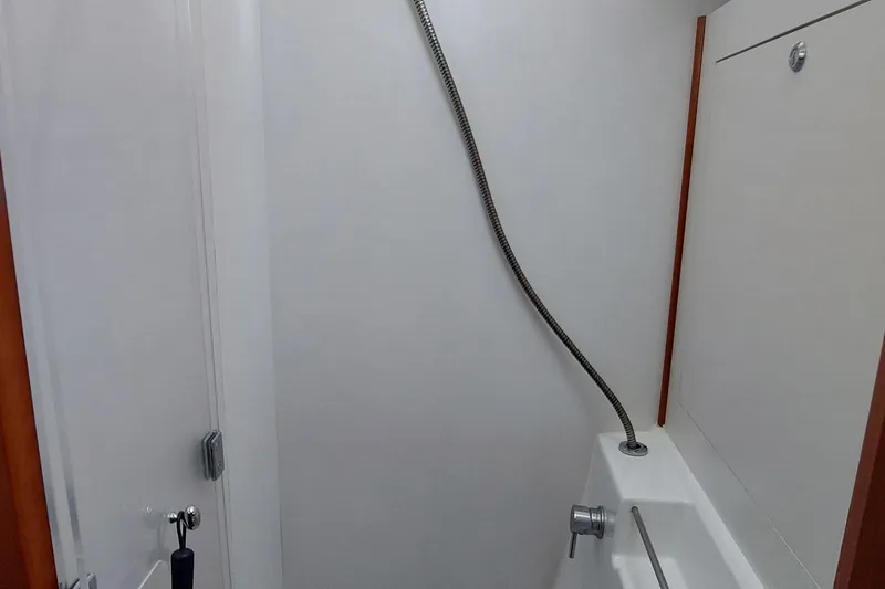 Slide: The Image of Shower area in 2015 Beneteau Oceanis 45 yacht, featuring sleek design and modern fixtures. - 64