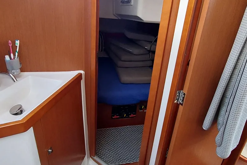 Slide: The Image of Interior of 2015 Beneteau Oceanis 45 yacht showing bathroom and cabin entrance. - 66
