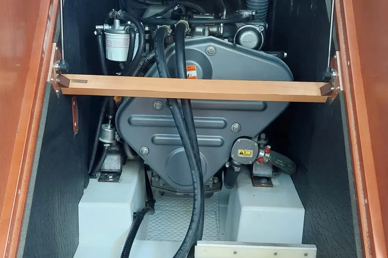 Slide: The Image of Engine compartment of a 2015 Beneteau Oceanis 45 sailboat, showcasing mechanical components. - 74