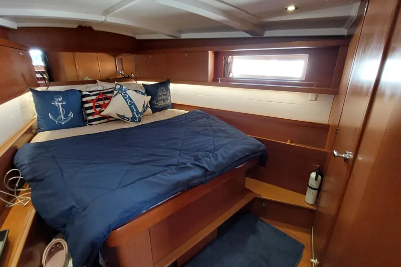 Slide: The Image of Cozy cabin interior of 2015 Beneteau Oceanis 45 with nautical-themed decor. - 79