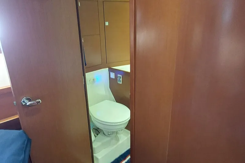 Slide: The Image of Interior view of 2015 Beneteau Oceanis 45 yacht bathroom with wooden finish. - 81