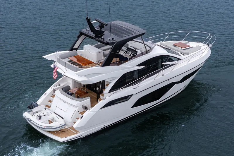 Slide: The Image of 2021 Sunseeker Manhattan 55 yacht cruising on open water, showcasing luxury design. - 12