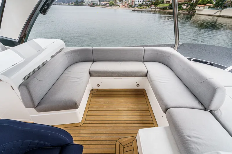 Slide: The Image of Luxurious seating area on 2021 Sunseeker Manhattan 55 yacht with waterfront view. - 20