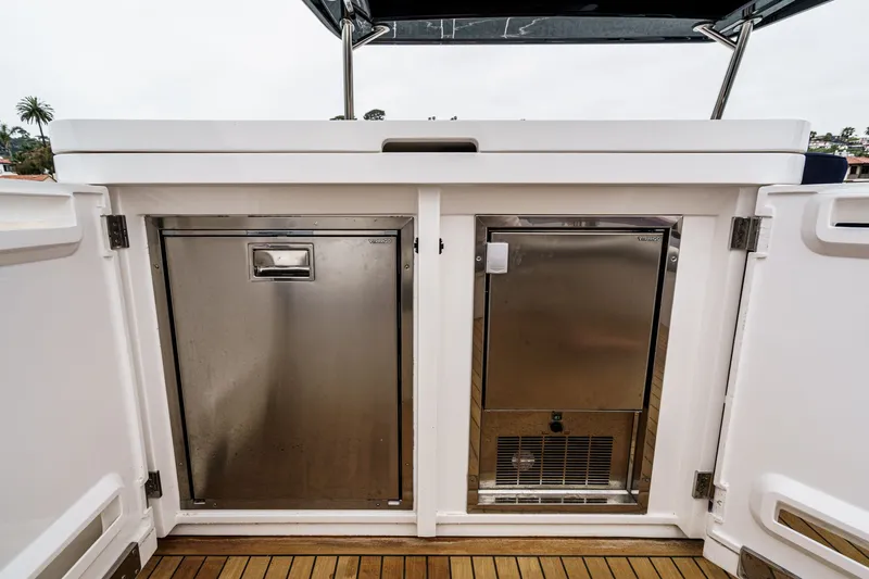 Slide: The Image of Sunseeker Manhattan 55 yacht, 2021 model, featuring stainless steel storage compartments. - 22