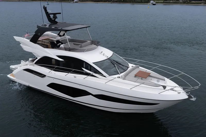 Slide: The Image of 2021 Sunseeker Manhattan 55 yacht cruising on calm waters. - 3