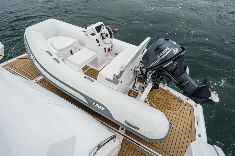 Slide: The Image of Luxury Sunseeker Manhattan 55 yacht with Yamaha-powered tender on teak deck, 2021 model. - 31