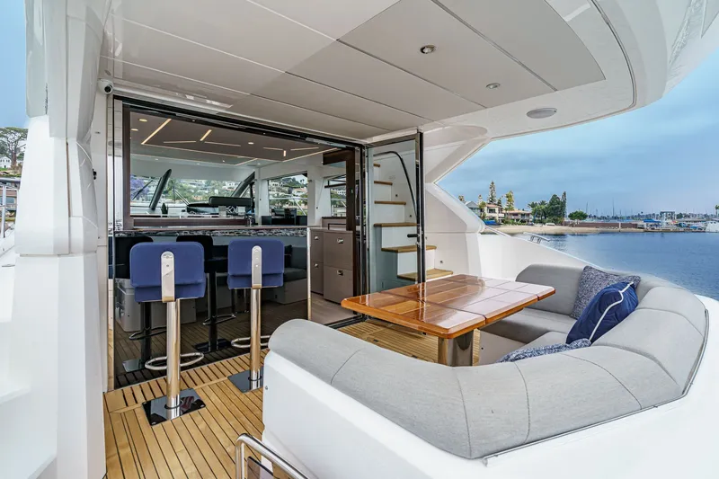 Slide: The Image of Luxurious 2021 Sunseeker Manhattan 55 yacht interior with elegant seating and ocean view. - 39