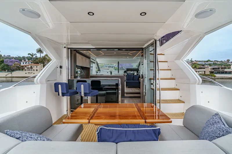 Slide: The Image of Luxurious 2021 Sunseeker Manhattan 55 yacht interior with elegant seating and wooden table. - 40