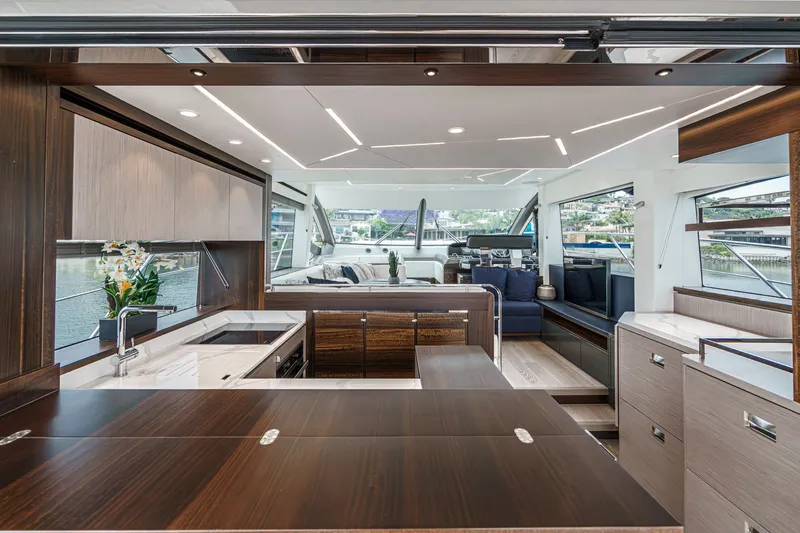 Slide: The Image of Luxurious interior of 2021 Sunseeker Manhattan 55 yacht with modern kitchen and seating area. - 43