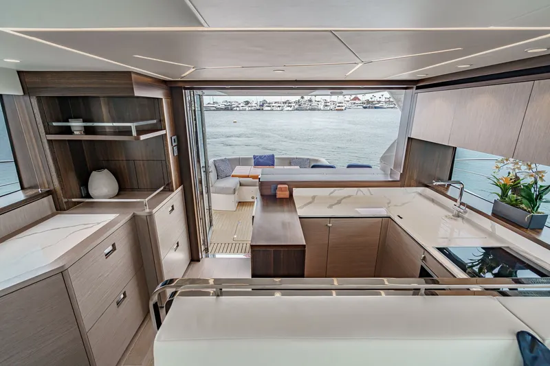 Slide: The Image of Luxurious interior of 2021 Sunseeker Manhattan 55 yacht with modern kitchen and waterfront view. - 44
