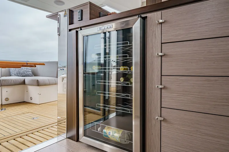 Slide: The Image of Luxury interior of 2021 Sunseeker Manhattan 55 yacht with wine cooler and seating area. - 46