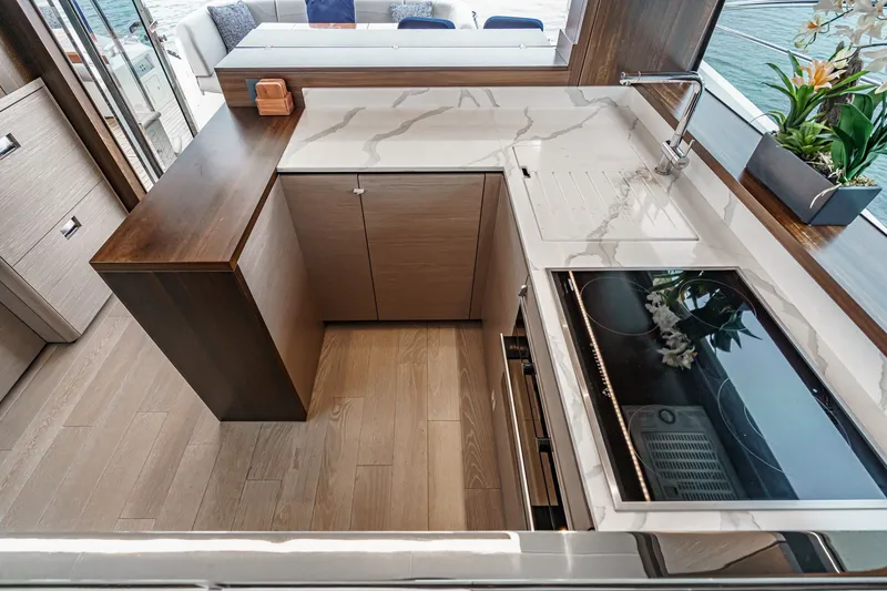 Slide: The Image of Modern kitchen interior on 2021 Sunseeker Manhattan 55 yacht, featuring sleek countertops and appliances. - 47