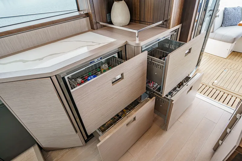 Slide: The Image of Modern kitchen drawers on 2021 Sunseeker Manhattan 55 yacht, featuring sleek design and ample storage. - 49