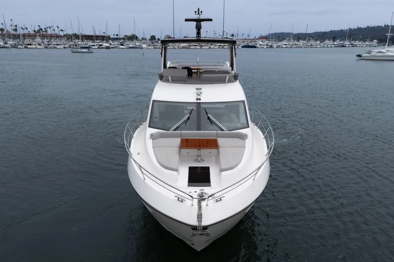 Slide: The Image of 2021 Sunseeker Manhattan 55 yacht docked in a marina, front view. - 6