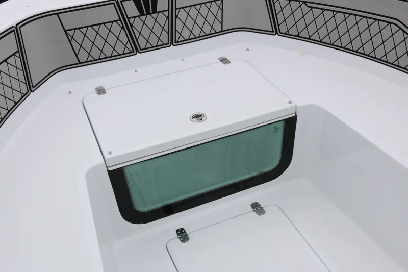 Slide: The Image of 2025 Wellcraft 202 Fisherman boat interior with storage compartment and netted side panels. - 14