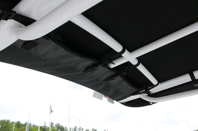 Slide: The Image of 2025 Wellcraft 202 Fisherman T-top frame with black canvas cover. - 18