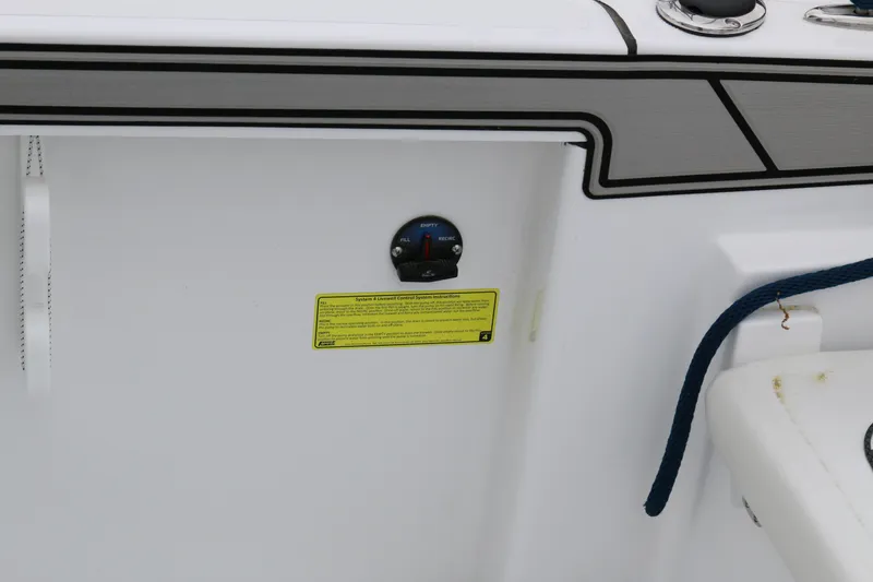 Slide: The Image of 2025 Wellcraft 202 Fisherman boat interior with gauge and safety instructions. - 30