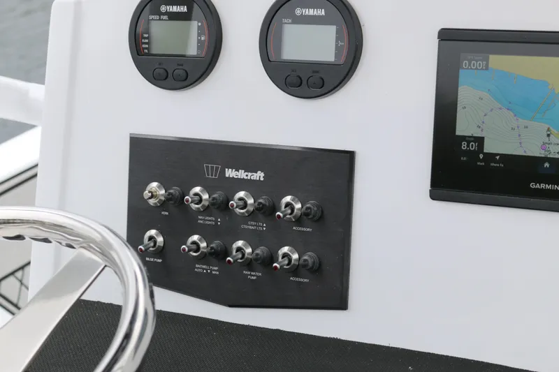 Slide: The Image of Control panel of 2025 Wellcraft 202 Fisherman boat with Yamaha gauges and Garmin display. - 45