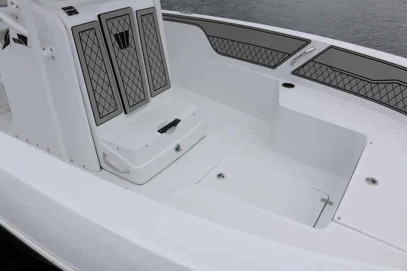 Slide: The Image of 2025 Wellcraft 202 Fisherman boat interior with sleek seating and storage compartments. - 9
