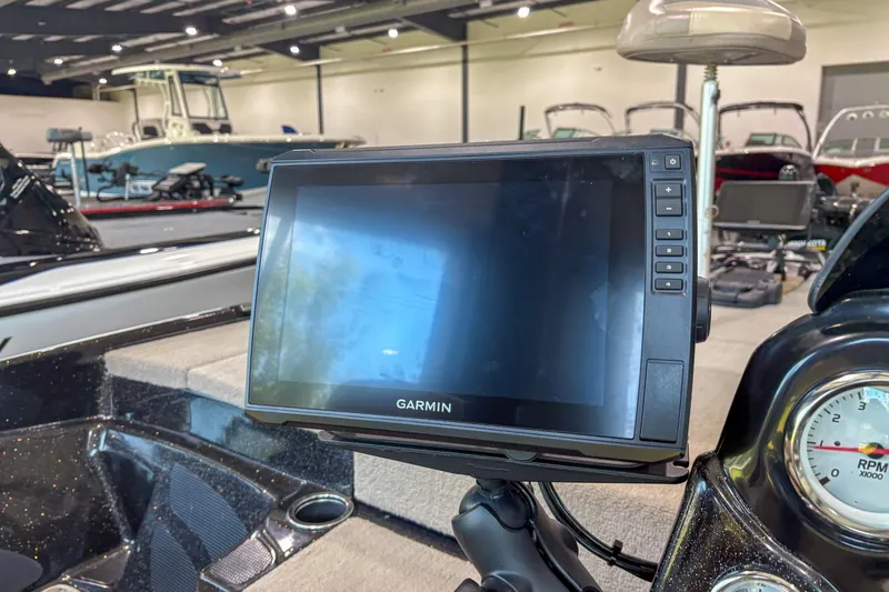 Slide: The Image of Garmin display on 2013 Nitro Z6 boat dashboard in showroom setting. - 12