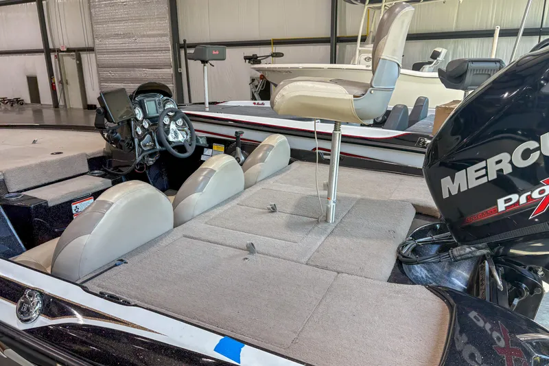 Slide: The Image of 2013 Nitro Z6 boat interior with Mercury Pro XS engine, featuring seating and control panel. - 6