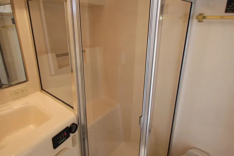 Slide: The Image of Bathroom interior of 2000 Silverton 37 Convertible yacht with shower and sink. - 35