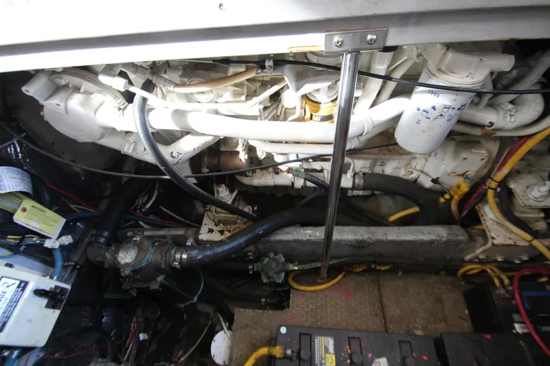 Slide: The Image of Engine compartment of a 2000 Silverton 37 Convertible boat, showing mechanical components and wiring. - 39