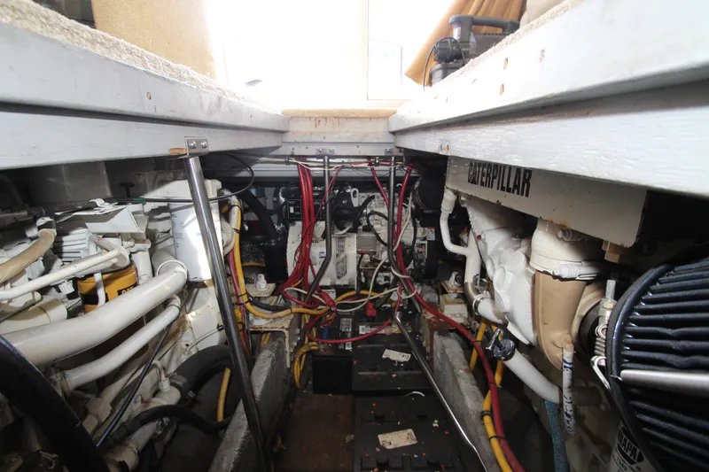 Slide: The Image of Engine room of 2000 Silverton 37 Convertible boat with Caterpillar components and wiring. - 44