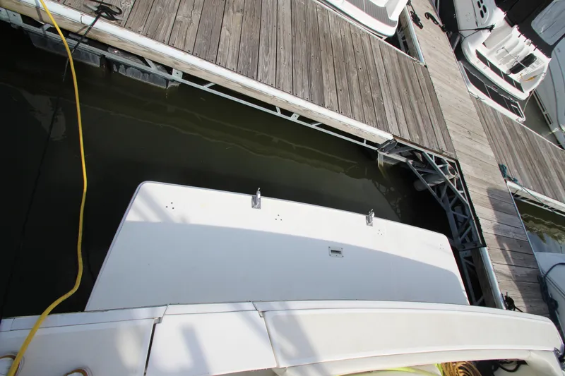 Slide: The Image of 2000 Silverton 37 Convertible docked at marina, viewed from above. - 9