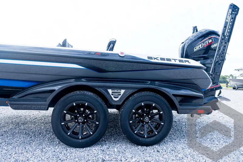 Slide: The Image of 2026 Skeeter FXR21 FLEX boat with dual axle trailer and Yamaha engine. - 33